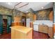 Kitchen boasts wood cabinets, island, and wood floors at 1340 N Gilpin St, Denver, CO 80218