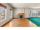 Living room with hardwood floors, fireplace, and large windows at 1340 N Gilpin St, Denver, CO 80218