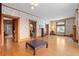 Spacious living room with hardwood floors and decorative wallpaper at 1340 N Gilpin St, Denver, CO 80218