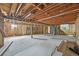 Spacious unfinished basement with exposed ceiling beams, ideal for future expansion and design possibilities at 796 S Bristol St, Lakewood, CO 80228