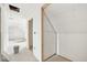 Spacious unfinished bedroom featuring a doorway and sloped ceilings, offering potential for a cozy retreat at 796 S Bristol St, Lakewood, CO 80228