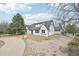 Charming single-Gathering home with a white brick exterior and a gray roof at 796 S Bristol St, Lakewood, CO 80228