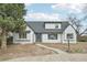 Charming single-Gathering home with a white brick exterior and a gray roof at 796 S Bristol St, Lakewood, CO 80228