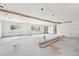 Living room with exposed ceiling and white drywall at 796 S Bristol St, Lakewood, CO 80228