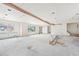 Living room with exposed ceiling and white drywall at 796 S Bristol St, Lakewood, CO 80228