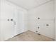 Room under renovation with a closed white door, ready to be transformed into a functional space at 796 S Bristol St, Lakewood, CO 80228