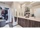 Bathroom with double vanity, modern fixtures, and walk-in closet at 20 Wilcox St # 308, Castle Rock, CO 80104