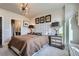 Bedroom featuring a decorative headboard, designer lighting, and a scenic view at 20 Wilcox St # 308, Castle Rock, CO 80104