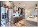 Well-equipped kitchen with a stainless steel refrigerator, modern appliances, and bright white countertop at 20 Wilcox St # 308, Castle Rock, CO 80104