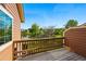 Open-air balcony boasting relaxing views of a lake, mature trees and nearby neighborhood scenery at 3240 W 114Th Cir # D, Westminster, CO 80031