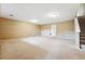 Expansive unfinished basement with carpet and access to stairs offers customization potential at 3240 W 114Th Cir # D, Westminster, CO 80031