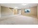 Large unfinished basement with carpet, window, and natural light is ready for personalization at 3240 W 114Th Cir # D, Westminster, CO 80031