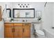 Updated bathroom with modern lighting, wood cabinetry, and new fixtures at 3240 W 114Th Cir # D, Westminster, CO 80031