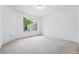 Bright, carpeted bedroom with a large window bringing in lots of natural light at 3240 W 114Th Cir # D, Westminster, CO 80031