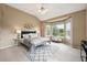 Bright bedroom featuring a large bay window offering scenic views and plush decor at 3240 W 114Th Cir # D, Westminster, CO 80031