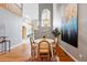 Dining area with unique light fixture, hardwood floors and views to living areas at 3240 W 114Th Cir # D, Westminster, CO 80031