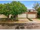 Inviting townhome exterior with attached garages, featuring well-maintained landscaping and mature trees at 3240 W 114Th Cir # D, Westminster, CO 80031