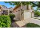 Close-up of a townhome with brick accents, an attached garage, and a well-kept lawn at 3240 W 114Th Cir # D, Westminster, CO 80031