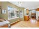 Bright eat-in kitchen with large windows and wood floors at 3240 W 114Th Cir # D, Westminster, CO 80031