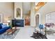 Spacious living room featuring a black brick fireplace, hardwood accents, and modern furnishings at 3240 W 114Th Cir # D, Westminster, CO 80031