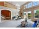 Open living room features a second-floor view, neutral tones, and access to an outdoor deck at 3240 W 114Th Cir # D, Westminster, CO 80031