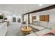 Expansive finished basement boasting a spacious layout, comfortable seating, and natural light at 2765 W Denver Pl, Denver, CO 80211