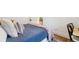Cozy bedroom featuring hardwood floors, area rug, and neutral decor at 2765 W Denver Pl, Denver, CO 80211