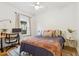 Bedroom features a bed, desk, and hardwood floors at 2765 W Denver Pl, Denver, CO 80211