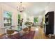 Bright dining room with open layout, stylish decor and dining set adjacent to living space at 2765 W Denver Pl, Denver, CO 80211