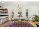 Dining area with stylish table and chairs, decorative lighting, and open to the living room area at 2765 W Denver Pl, Denver, CO 80211