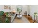 Inviting living room with a comfortable olive green sofa, stylish decor and plenty of natural light at 2765 W Denver Pl, Denver, CO 80211