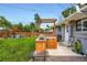 Backyard with patio, pergola, built in BBQ, and landscaped yard at 3775 S Green Ct, Englewood, CO 80110