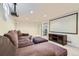 Spacious basement with plush brown sectional couch and home theater setup at 3775 S Green Ct, Englewood, CO 80110
