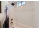 Bathroom shower/tub features white subway tile and stylish fixtures at 3775 S Green Ct, Englewood, CO 80110