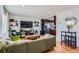 Bright and airy living space with hardwood floors, an olive sofa, and modern decor at 3775 S Green Ct, Englewood, CO 80110