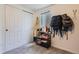 Finished storage room features closet, shelving, surfboard, and games at 3775 S Green Ct, Englewood, CO 80110