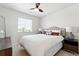 Bright bedroom featuring a ceiling fan, window, and well-appointed furnishings at 16975 Melody Dr, Broomfield, CO 80023