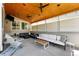 Inviting covered patio featuring comfortable seating, string lights, and ceiling fans at 16975 Melody Dr, Broomfield, CO 80023