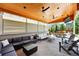 Stylish covered patio featuring comfortable seating, ceiling fans, and string lights at 16975 Melody Dr, Broomfield, CO 80023