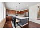 This modern kitchen features a large island, abundant cabinetry, and updated appliances for cooking convenience at 16975 Melody Dr, Broomfield, CO 80023