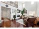 Bright living room features a modern fireplace, hardwood floors, and an open floor plan at 16975 Melody Dr, Broomfield, CO 80023