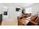 Inviting loft area with comfortable seating, TV, and ample natural light provides a perfect spot to unwind and relax at 16975 Melody Dr, Broomfield, CO 80023