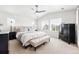 Tranquil main bedroom with ceiling fan, light-filled windows, and neutral tones creates a peaceful and relaxing retreat at 16975 Melody Dr, Broomfield, CO 80023