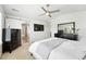 Spacious main bedroom boasts a serene en-suite bathroom and a stylish dresser, providing comfort and functionality at 16975 Melody Dr, Broomfield, CO 80023