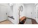 Practical mud room featuring built-in storage, a wooden bench, and easy access to the home's entrance at 16975 Melody Dr, Broomfield, CO 80023