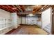 Spacious unfinished basement featuring exposed ceiling, rug and a window providing ample natural light at 4164 E 135Th Pl, Thornton, CO 80241