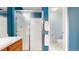 Bathroom featuring a single sink vanity with wood cabinets and frosted glass shower at 4164 E 135Th Pl, Thornton, CO 80241