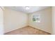 Bright bedroom with a large window providing ample natural light and a cozy atmosphere at 4164 E 135Th Pl, Thornton, CO 80241