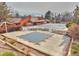 Community pool featuring a large pool with safety covers, a sunbathing area, and a brick building with skylights at 4164 E 135Th Pl, Thornton, CO 80241