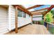 Inviting backyard deck with wooden beams, ideal for enjoying the private backyard views at 4164 E 135Th Pl, Thornton, CO 80241